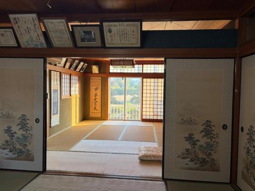 an entrance to a room with an open door at 麻心家azamiya in Nagao