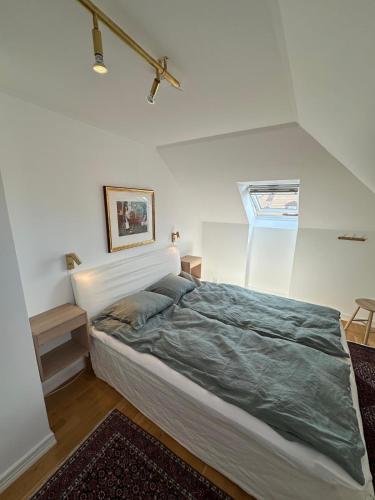 a bedroom with a large bed in a room at Fantastic accommodation in central Kalmar in Kalmar