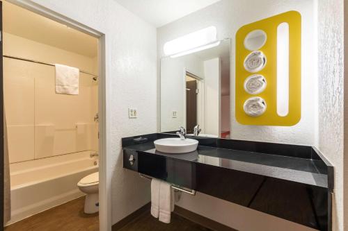 a bathroom with a sink and a toilet at Motel 6-Uvalde, TX in Uvalde