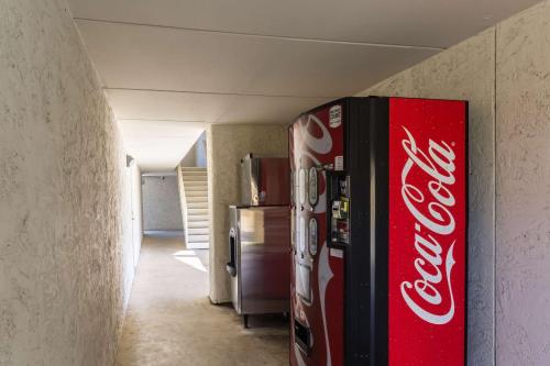 a coca cola refrigerator in a room at Motel 6-Uvalde, TX in Uvalde