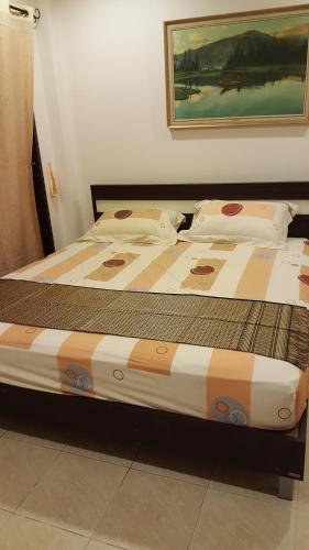 En eller flere senge i et værelse på Organgrinder Thai Paradise South