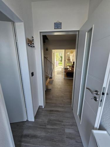 a hallway leading into a house with a hallway leading to a room at Ferienhaus 1260 in Tossens in Tossenserdeich