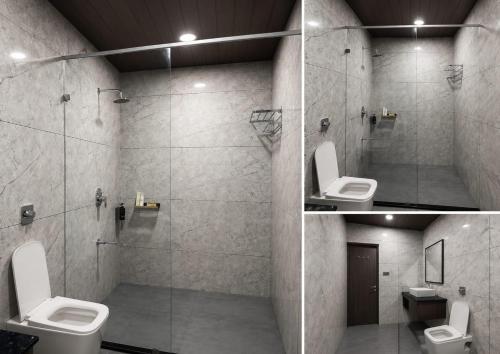 a bathroom with a shower with a toilet and a sink at Daksh Resort And Amusement Park in Sasan Gir