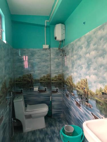a bathroom with a shower and a toilet and a sink at Fable homestay in Pedong