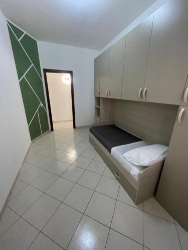 a small room with a bunk bed and a hallway at La Capaciota in Capaci