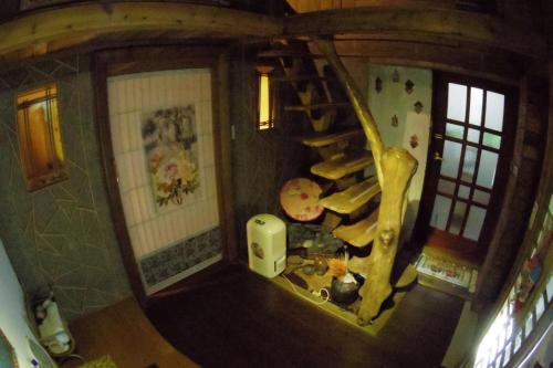 an overhead view of a room with a spiral staircase at A-HOME in Jiufen