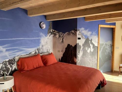 a bedroom with a red bed with a mountain mural at Lo Blan Morgex in Morgex