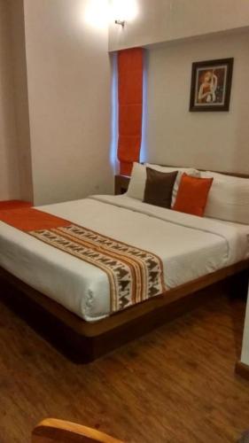 a bedroom with two beds in a room at Hotel Aravali in Mount Ābu