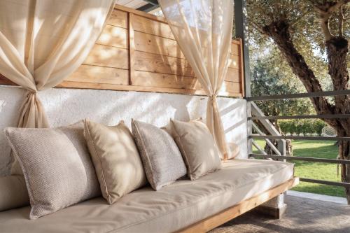 a couch in a room with a window at Vabel Skiathos in Skiathos
