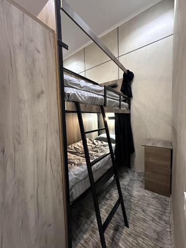 a couple of bunk beds in a room at Aslan Hostel in Samarkand
