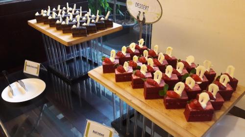 a display of brownies and desserts on a table at Hotel Santika Bogor in Bogor