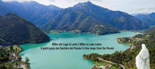 a view of a lake with mountains in the background at Appartamento Verde Lago Ledro in Molina di Ledro