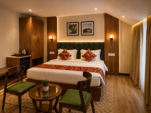 a hotel room with a bed and a table and chairs at The Countryside Resorts Pahalgam in Pahalgām