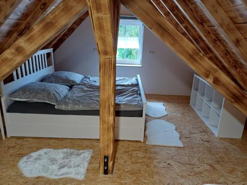 a bedroom with a bed in a attic at Ferienwohnung Landlust in Treuchtlingen