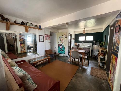 a living room with a couch and a table at Art House LU in San Fernando