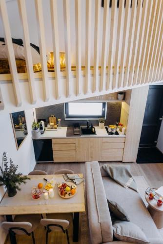 a living room with a table and a couch at Monside Resort - EARTH CABIN in Borzont