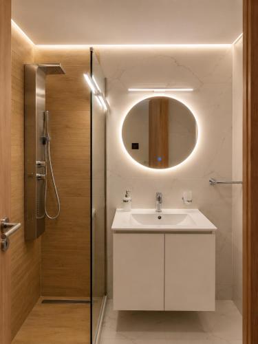 a bathroom with a sink and a mirror at United Cretan Villas Boutique Studio in Agia Marina Nea Kydonias