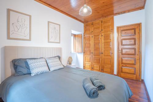 a bedroom with a bed with two pillows on it at Sao Mateus Ocean View in São Mateus