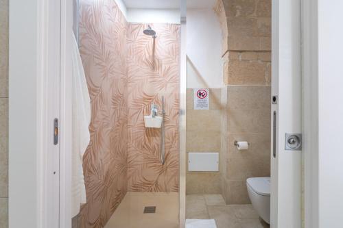 a bathroom with a shower and a toilet at Atena Ortigia in Syracuse