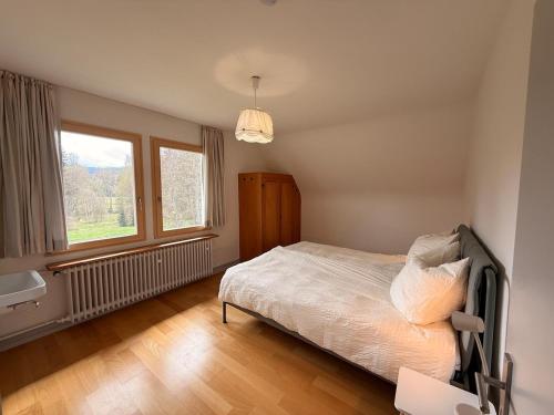 a bedroom with a bed and a window at berg zeit in Hinterzarten in Hinterzarten