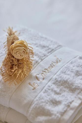 a close up of a napkin with a flower on it at Haussmannien calme hyper-centre in Troyes