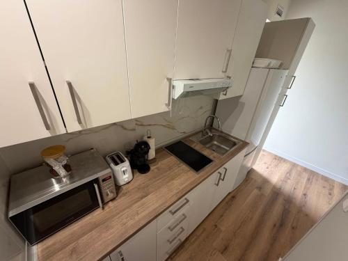 Køkken eller tekøkken på Apartamentos COTTAGE