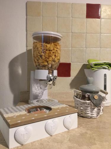 a food mixer sitting on a counter next to a basket at Domoruja B&B in Sassari