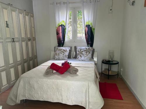 a bedroom with two beds with stuffed animals on it at Le cocon de Coco in Lamentin