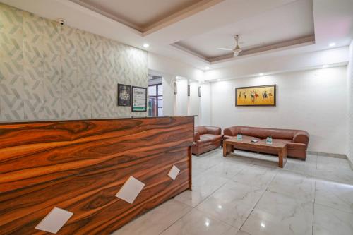a living room with a large wooden wall at Treebo Modern Stays in Noida