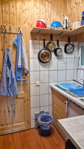a kitchen with some pots and pans on the wall at Ferienhaus am Edersee in Vöhl
