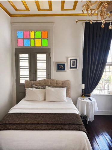 a bedroom with a bed and a stained glass window at No16 Ada in Adalar