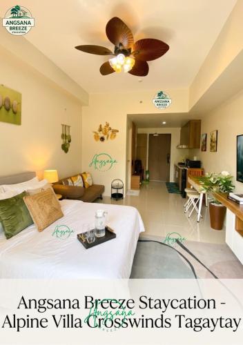 a bedroom with a bed and a ceiling fan at Angsana Breeze-Alpine Crosswinds Tagaytay in Ulot
