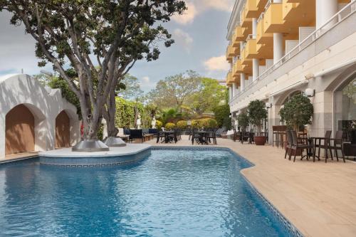 a swimming pool in the courtyard of a building at Augusta Club & Spa - Adults Only in Lloret de Mar
