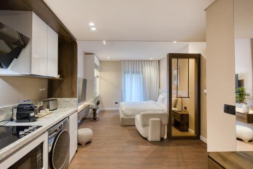 a hotel room with a bed and a kitchen at The Nile Residence in Cairo