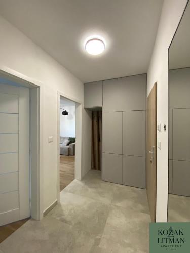 an empty room with a hallway with closets at Apartmán KOZAK LITMAN in Litmanová