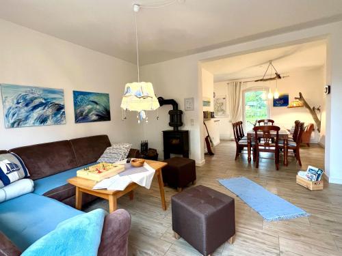 a living room with a couch and a table at Familienhaus Sonne in Mukran