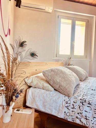 a bedroom with a bed with two pillows on it at La Rock House BnB in Mercato Saraceno