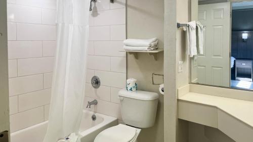 a bathroom with a toilet and a sink and a shower at Motel 6 Aurora, CO - Medical Center in Aurora
