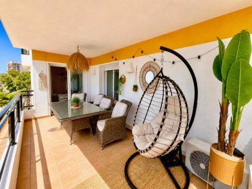 a living room with a hammock on a balcony at Roses Beach in Roses