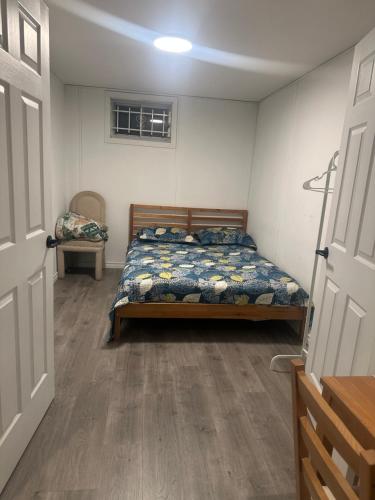 a bedroom with a bed in a room at Mill pond cozy and private 2 in Richmond Hill