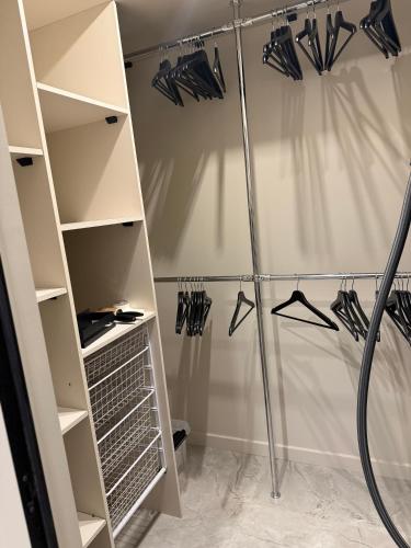 a walk in closet with shelves and hangers at The Baltic Sea Hideaway in Narva-Jõesuu