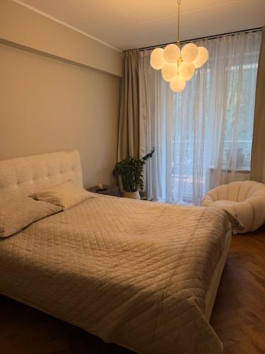 a bedroom with a bed and a large window at The Baltic Sea Hideaway in Narva-Jõesuu