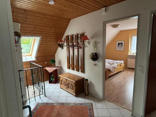 a room with a bedroom with a bed and a hallway at Gemütliche Ferien oder Monteurs Wohnung in Wallsbüll