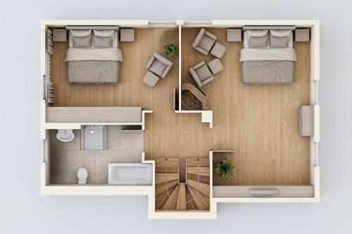 a floor plan of a room with two beds at Reethus am Küstenwald in Koserow