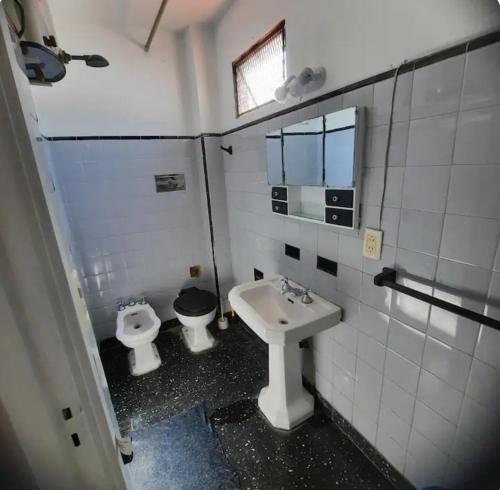 a bathroom with a toilet and a sink at LodelaAbuela 3 in Ciudadela