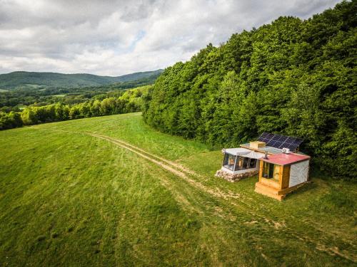 an aerial view of a small house in a field at Kajuta in Betliar