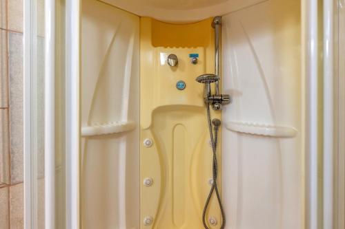a shower in the corner of a bathroom at La Perla in Latiano