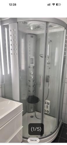 a shower stall in a bathroom with at Nordstrands Ro in Oslo