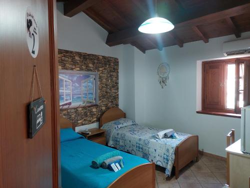 a room with two beds in a room at Il Nido dell'aquila in Sardara