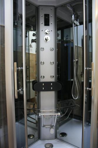 a control panel of a shower in a bathroom at El Teñao in Navamorisca